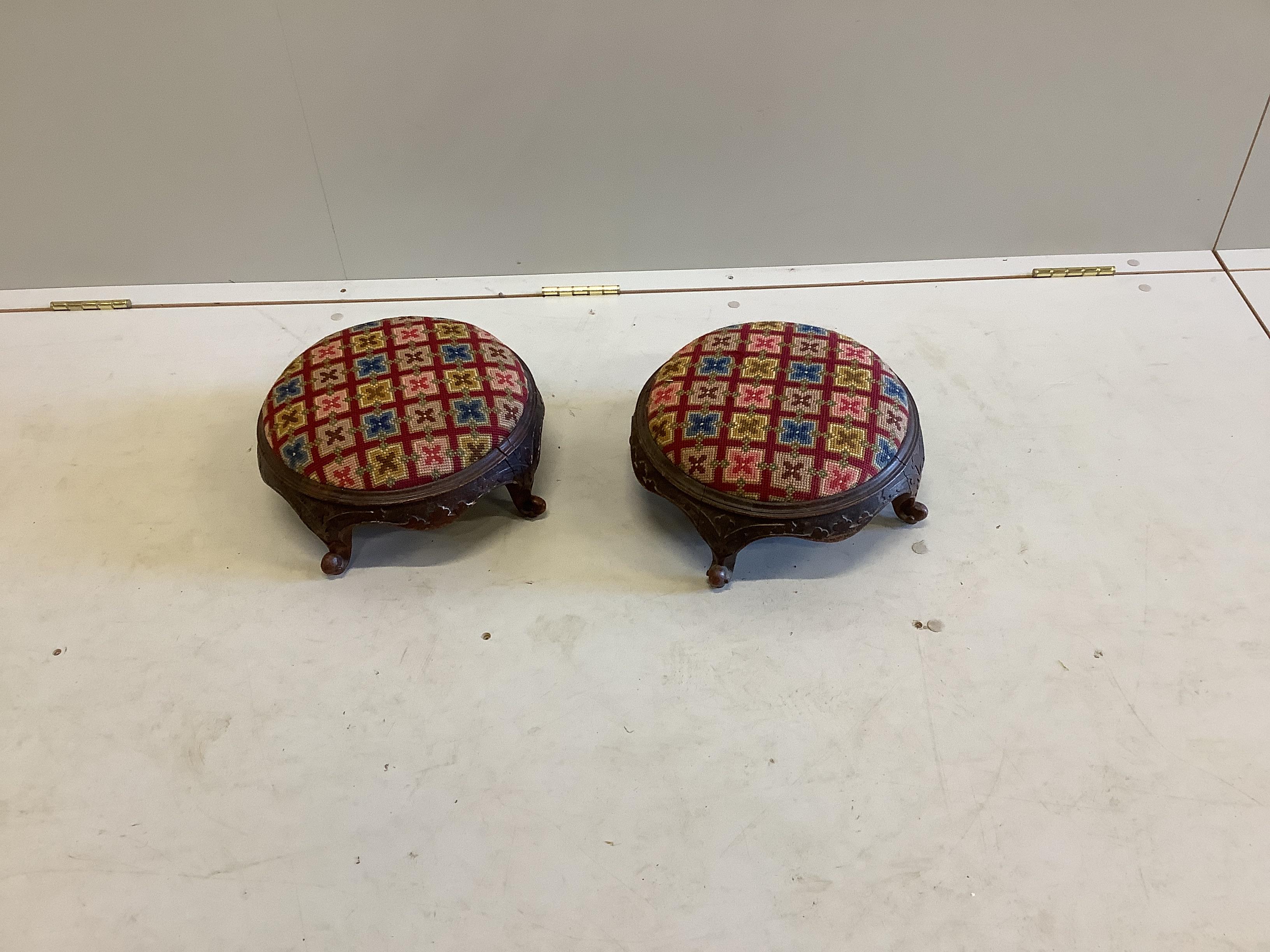 A pair of Victorian circular mahogany footstools, diameter 32cm, height 16cm